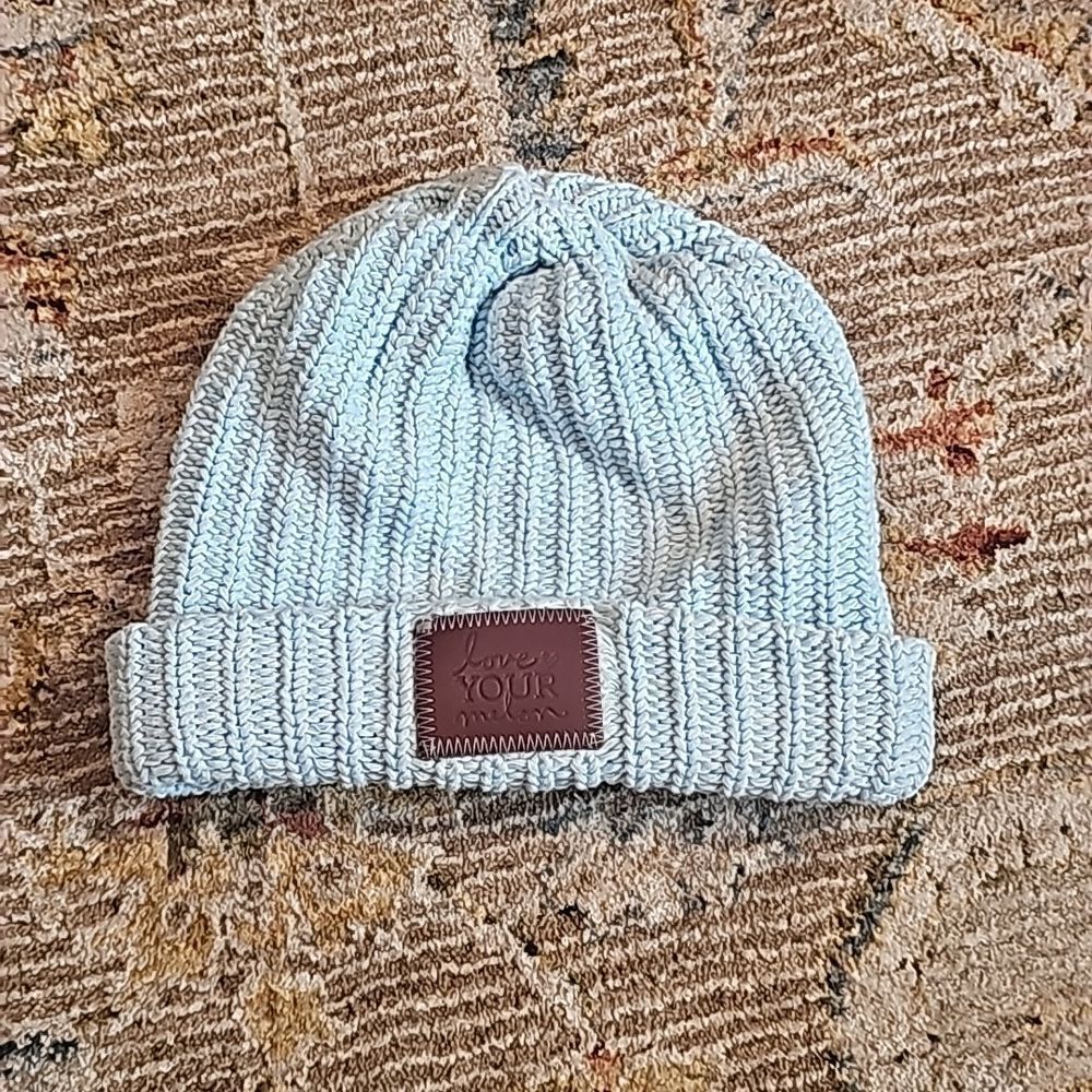 Love your melon baby blue and white beanie and brown leather patch